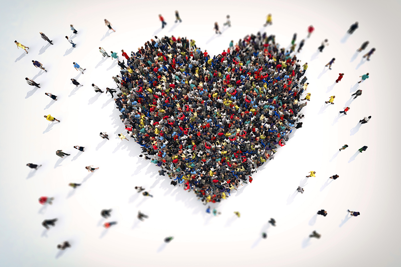 Ariel view of many people coming together to form a heart shape. Image represents the 10-10 Club concept. 
