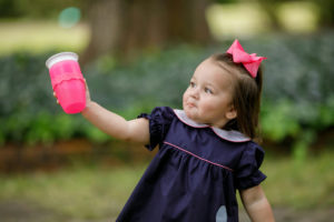 Young girl with sippy cup